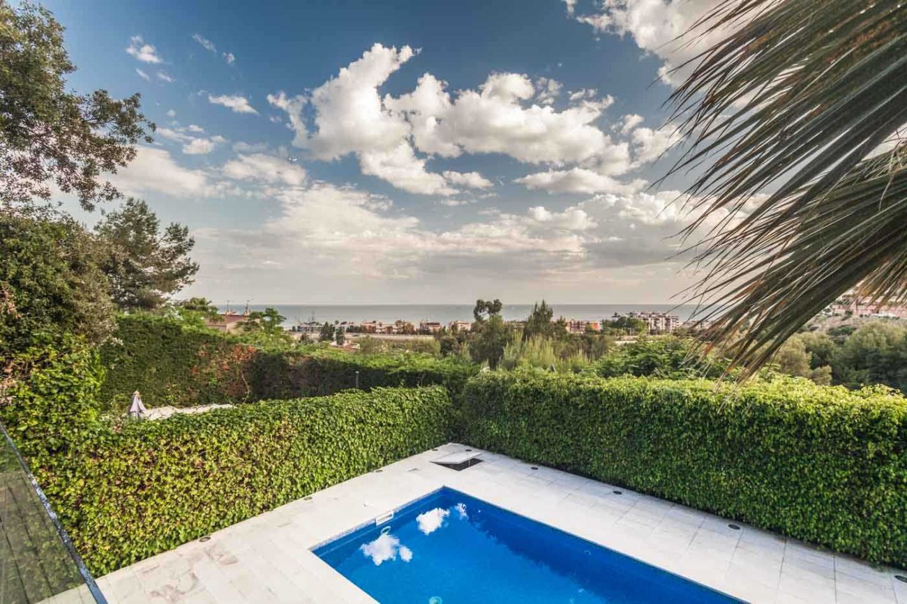 Sea view house in Castelldefels — cozy design with terraces and pool
